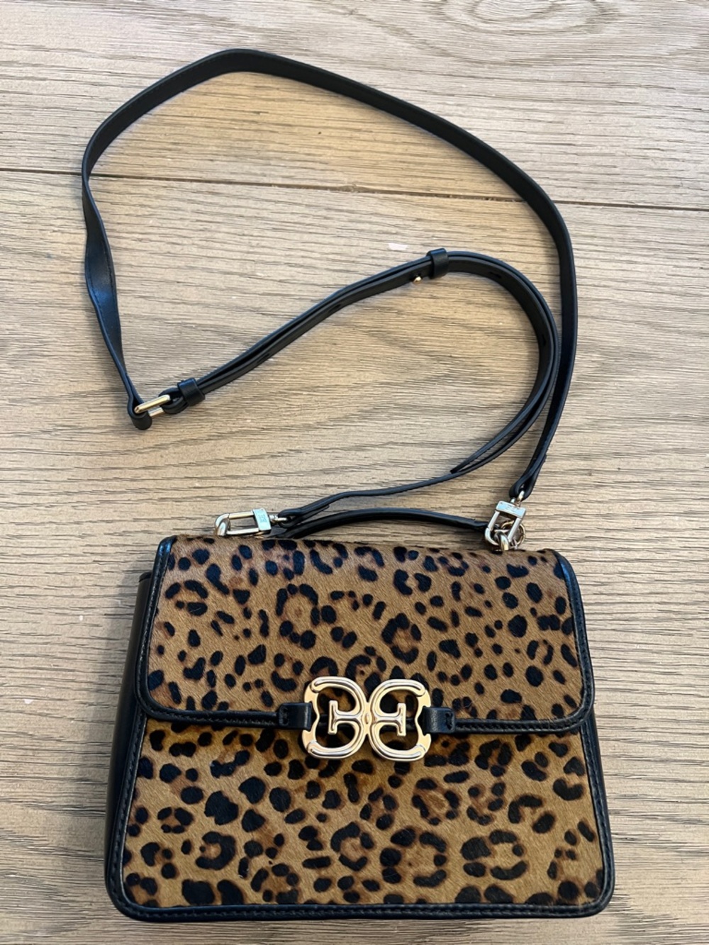 Sam Edelman Christy top handle Crossbody bag in a leopard print.